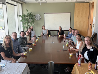 CCP team sitting at conference table with sundaes.